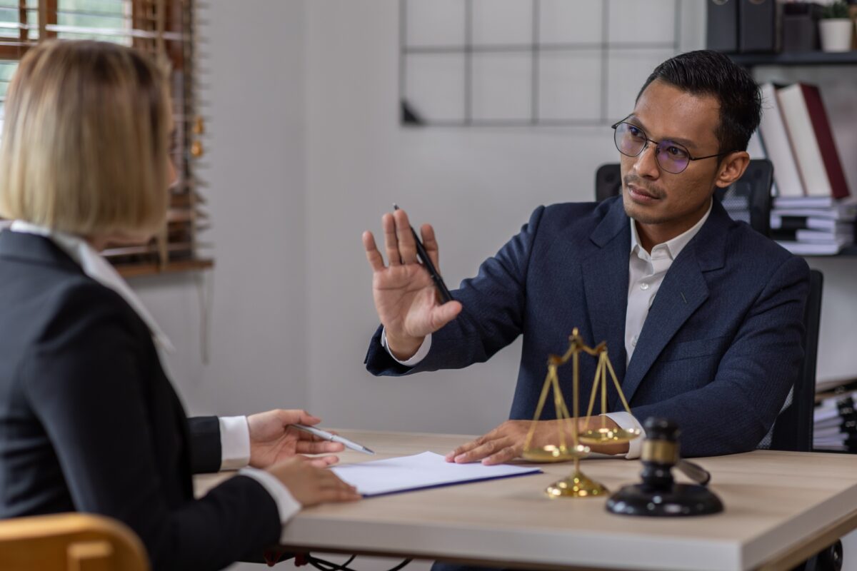 Business Asian people and lawyers, Businessman and lawyer discuss the contract document. Judge gavel